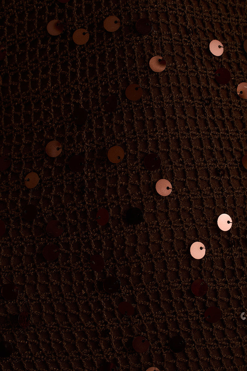 Espresso brown crochet knit fabric scattered with round sequins in a close-up detail.