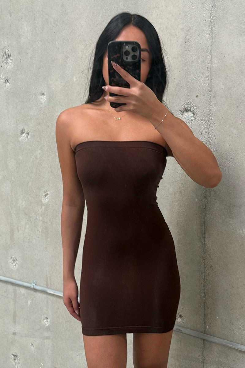Close-up of the Norma Brown Strapless Under Dress showcasing the fabric texture and design details.