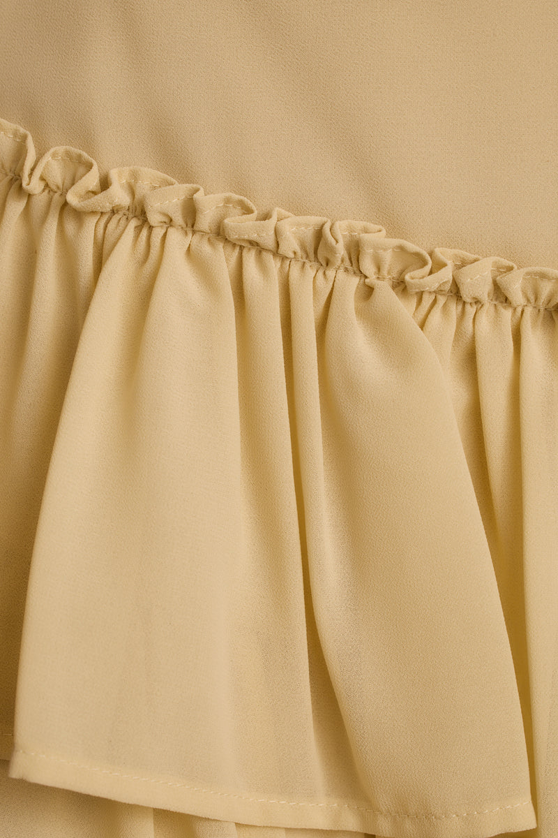 Panama Baby Yellow Chiffon Mini Skirt paired with complementary accessories for a polished look.