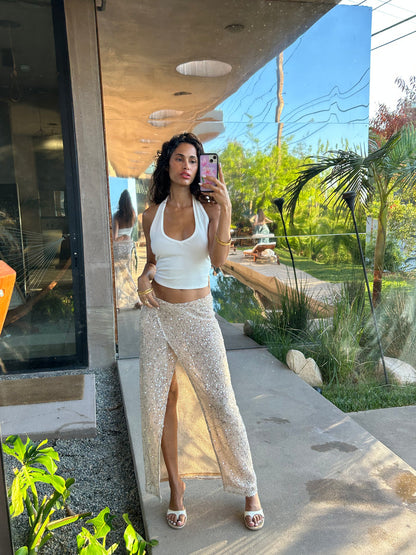 Lifestyle shot of the champagne maxi skirt styled for day-to-night versatility.