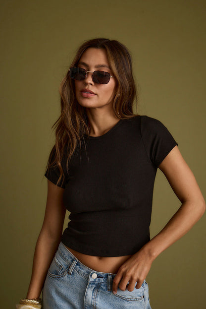 Black ribbed piece with ribbed detailing and a flattering silhouette.