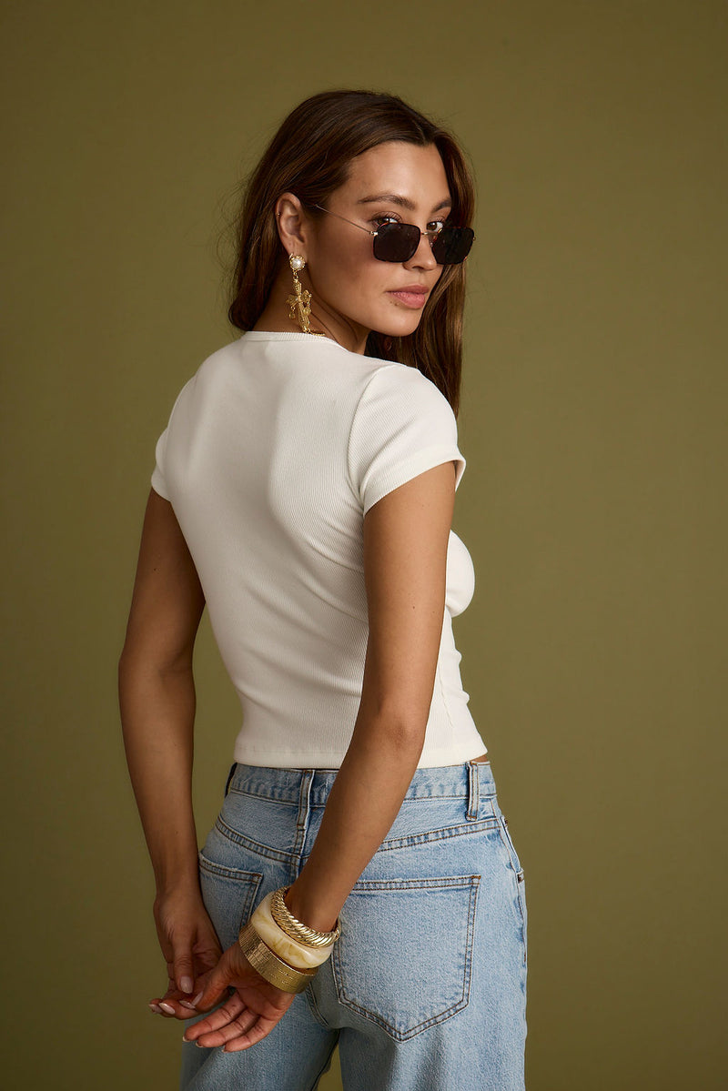Detail shot of the Abby White Ribbed Crew Neck Tee highlighting the ribbed elements.