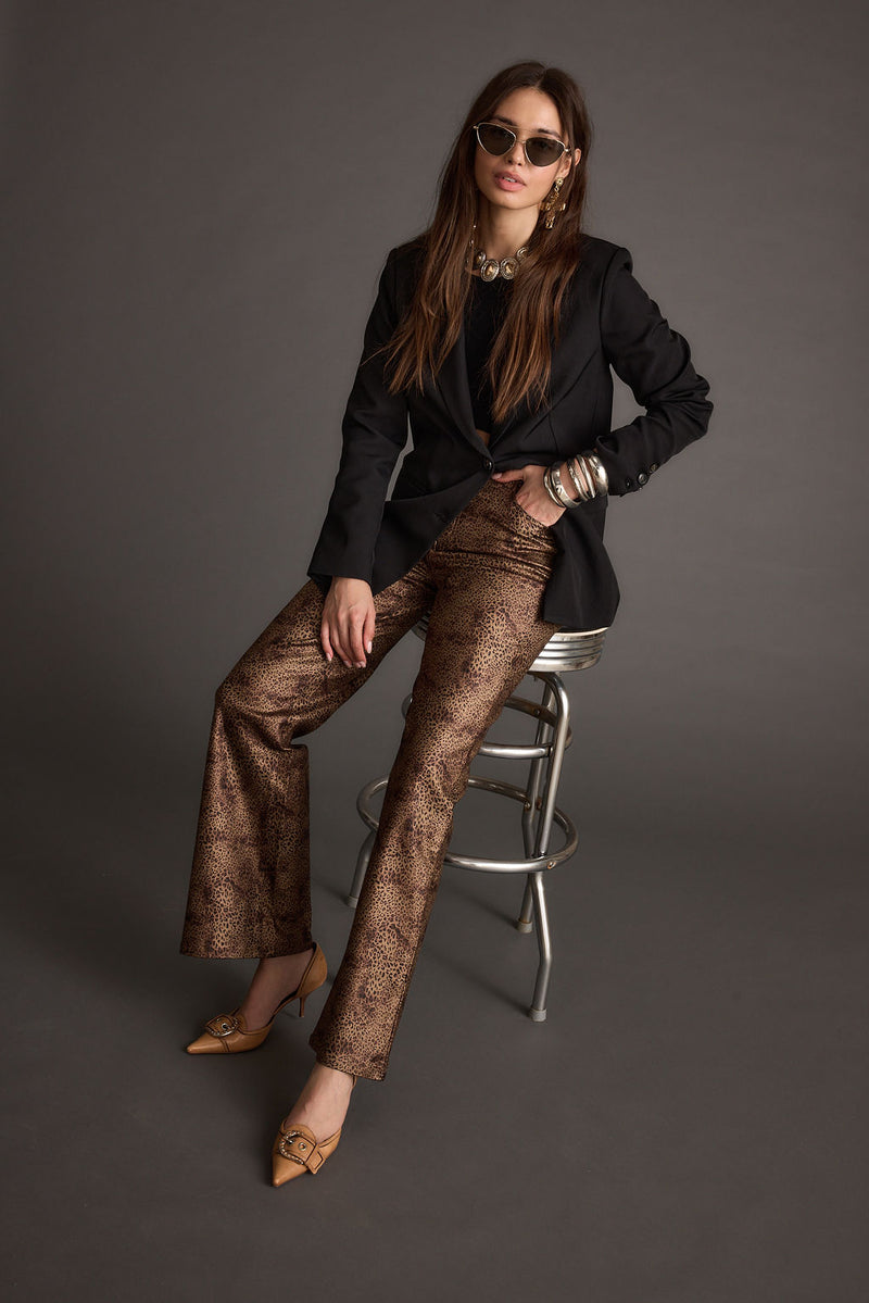Close-up of the After Hours Coated Leopard Pants showcasing the fabric texture and design details.