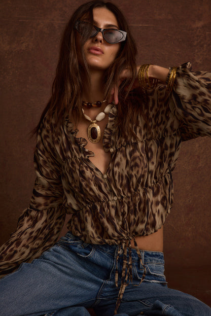 Lifestyle shot of the leopard print blouse styled for day-to-night versatility.