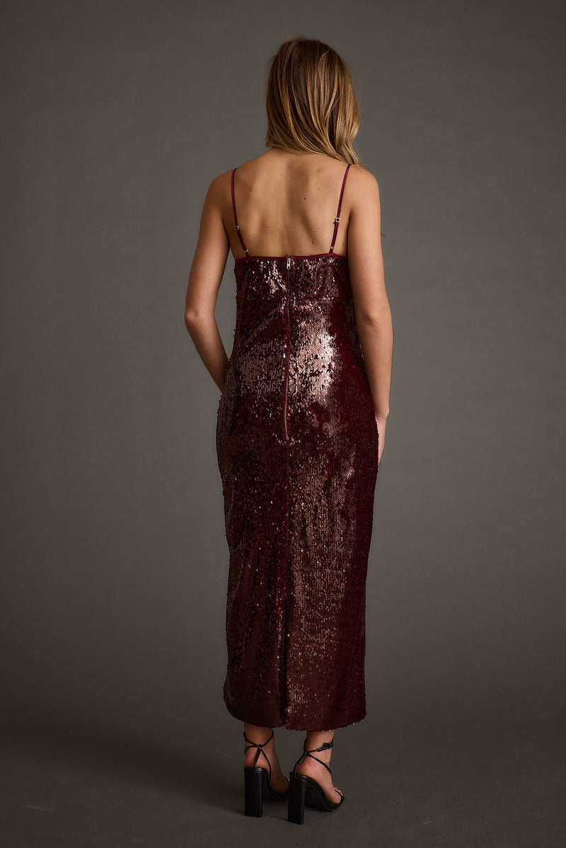 Close-up of the All For You Merlot Sequin Rosette Midi Dress showcasing the sequin texture and craftsmanship.