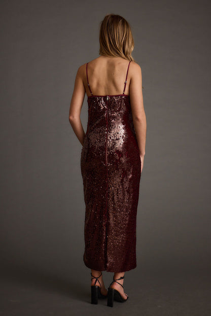 Close-up of the All For You Merlot Sequin Rosette Midi Dress showcasing the sequin texture and craftsmanship.