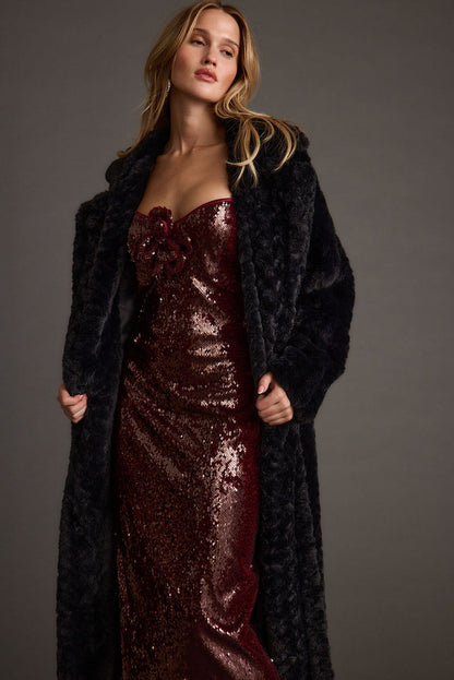 Full-length view of the midi dress showing the drape and movement.