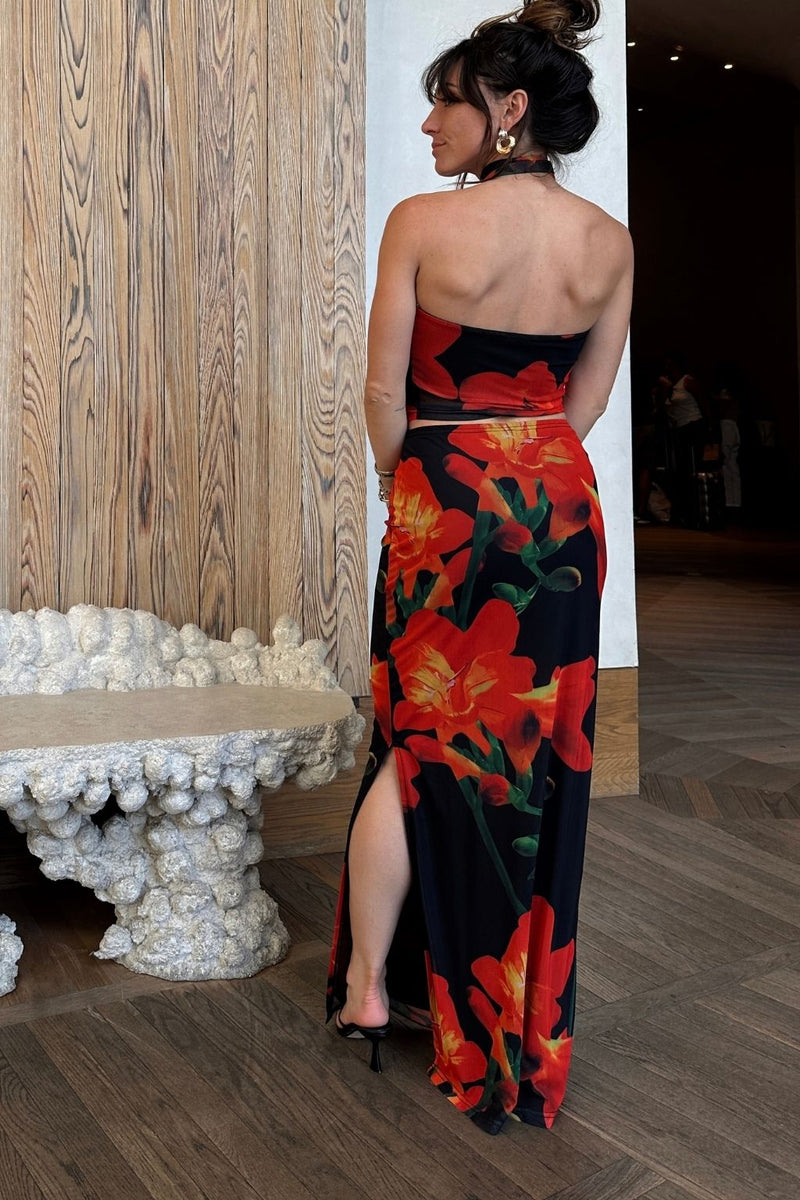 Full-length view of the floral top showing the drape and movement.
