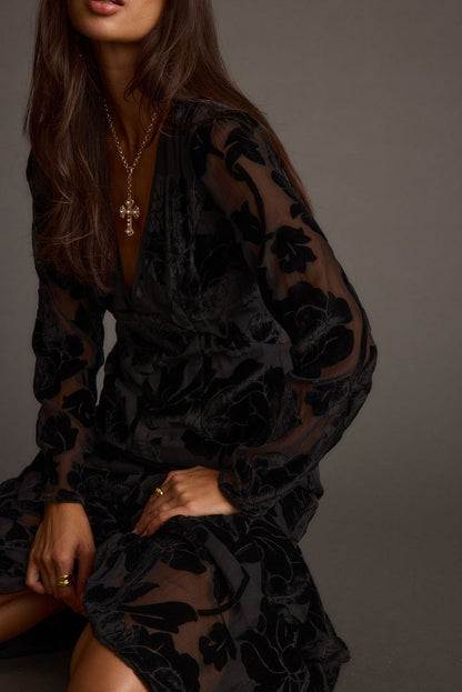 Lifestyle shot of the black maxi dress styled for day-to-night versatility.