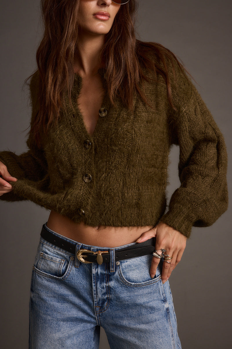 Archie Olive Cropped Cardigan paired with complementary accessories for a polished look.