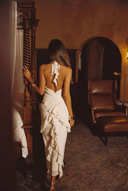 Back view of the cream maxi dress showing the silhouette and fit.