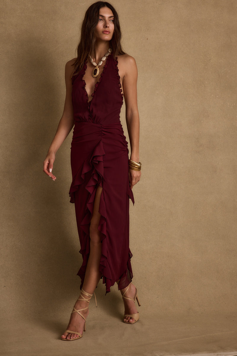 Halter maxi dress with elegant accents, a vacation maxi dress essential.