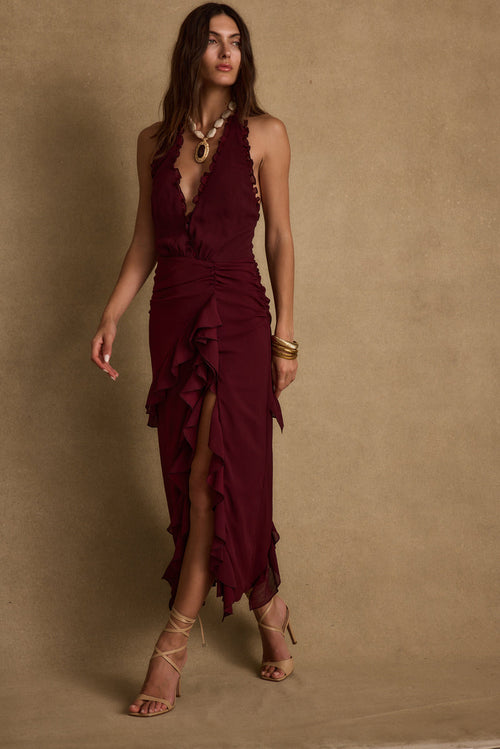 Halter maxi dress with elegant accents, a vacation maxi dress essential.