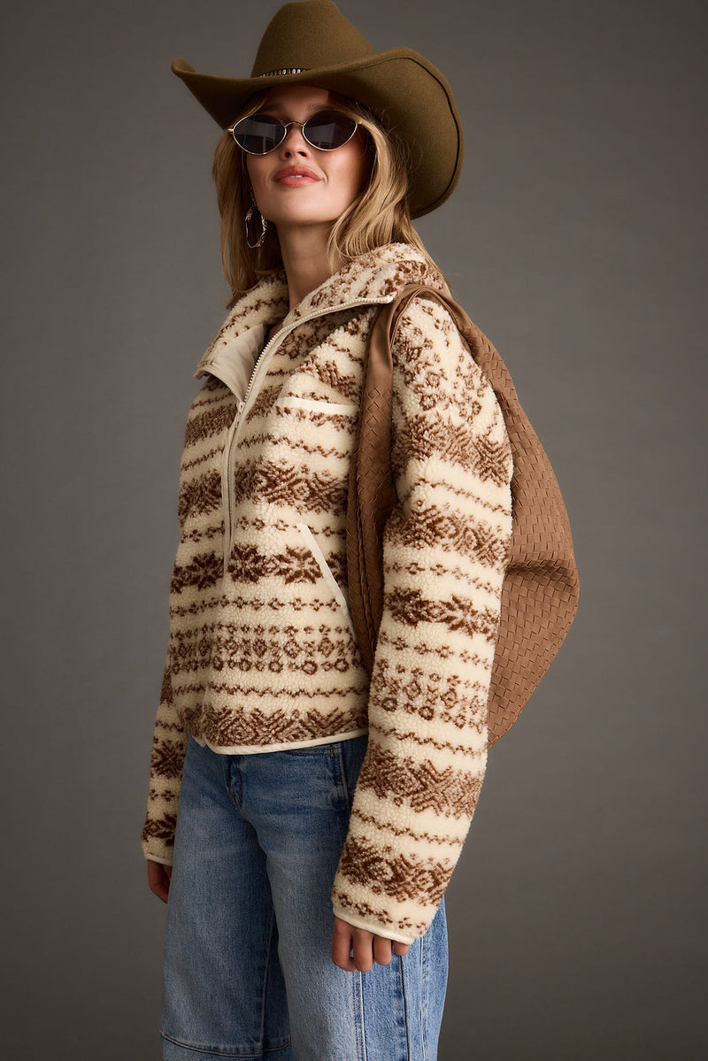 Cream and brown Fair Isle sherpa jacket styled with cowboy hat and jeans.