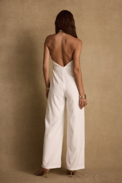Back view of the white jumpsuit showing the silhouette and fit.