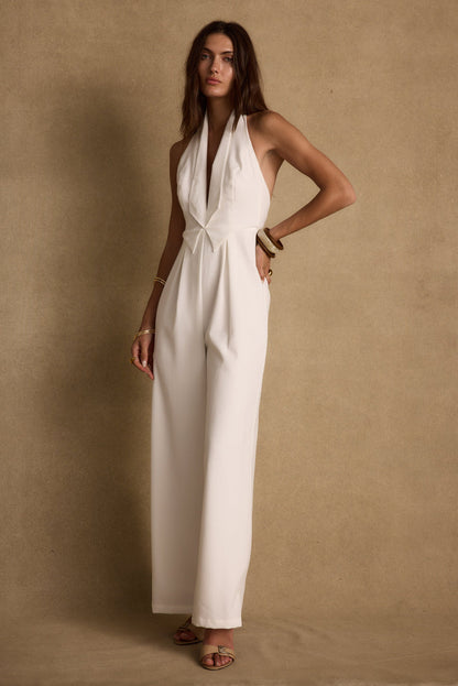 Close-up of the Astoria White Plunge Halter Tailored Jumpsuit showcasing the fabric texture and design details.