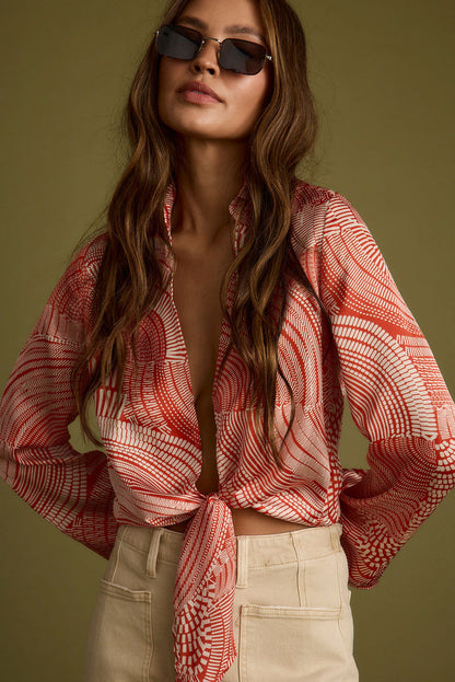 Rust top with elegant accents, a long sleeve sequin top essential.