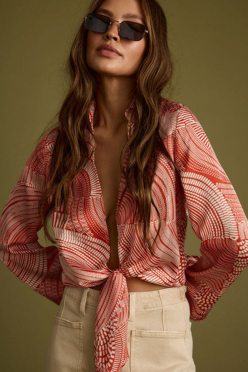 Rust top with elegant accents, a long sleeve sequin top essential.