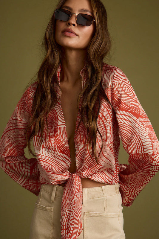 Rust top with elegant accents, a long sleeve sequin top essential.