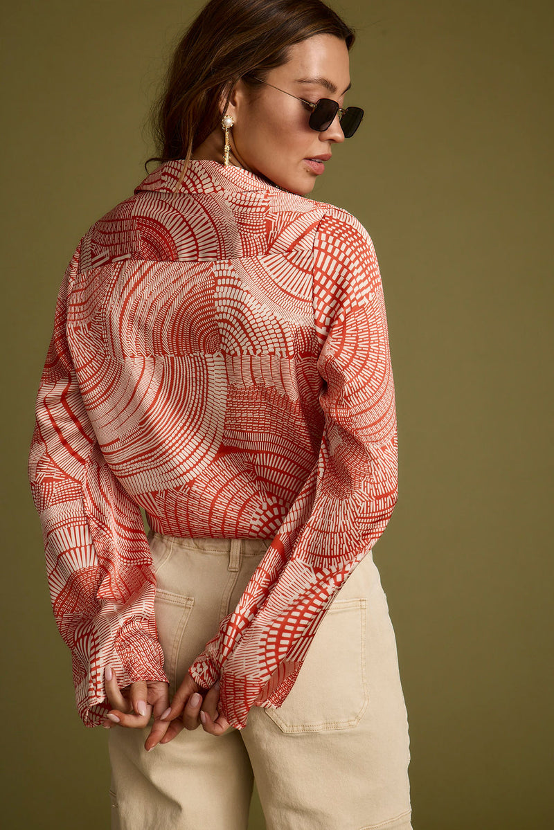 Back view of the rust top showing the silhouette and fit.
