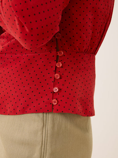 SILVIA red plumetis crossover blouse, detail of batwing sleeves by Rouje