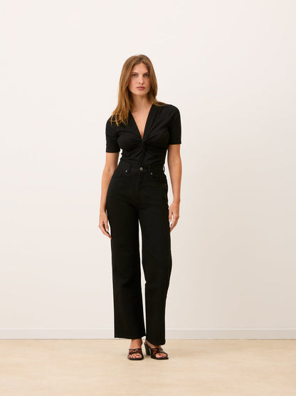 ANDERSON black draped tied stretch bodysuit, side view by Rouje