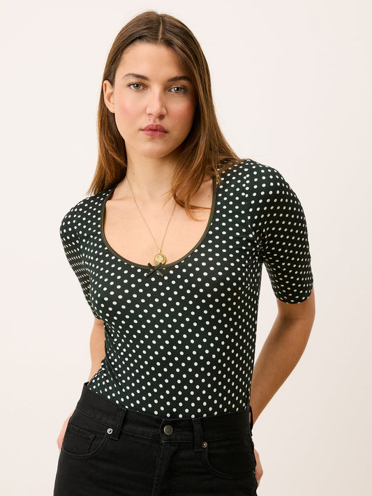 Green polka dot bodysuit, front view, worn by a model