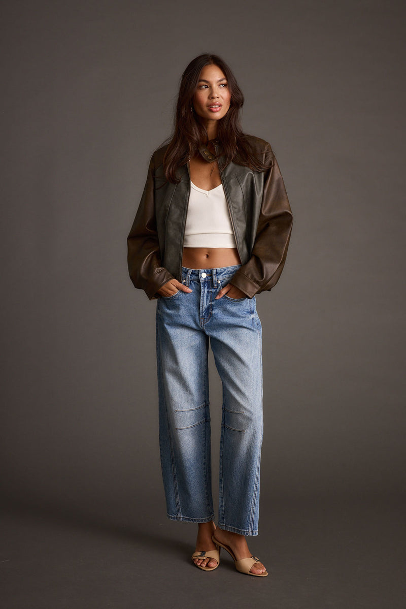 Back view of the moto jacket showing the silhouette and fit.