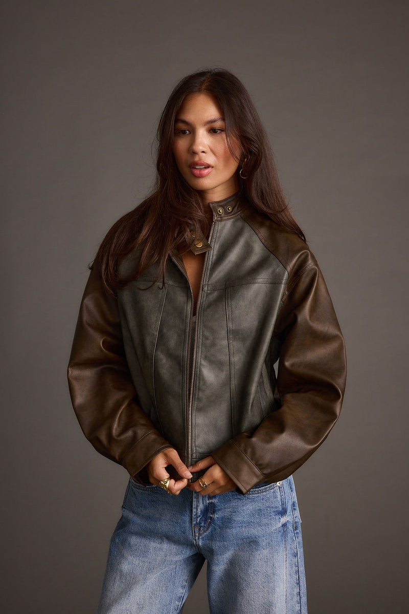 Close-up of the Bowery Color Block Moto Jacket showcasing the fabric texture and design details.