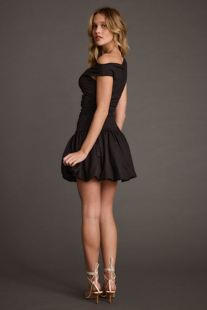 Detail shot of the Bridget Black Off the Shoulder Bubble Hem Mini Dress highlighting the design elements.