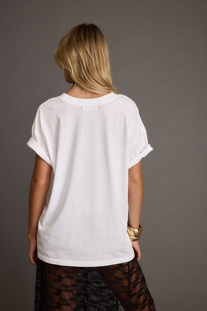 Back view of the white piece showing the silhouette and fit.