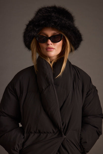 Detail shot of the Bucket Down Black Faux Fur Hat highlighting the faux fur elements.