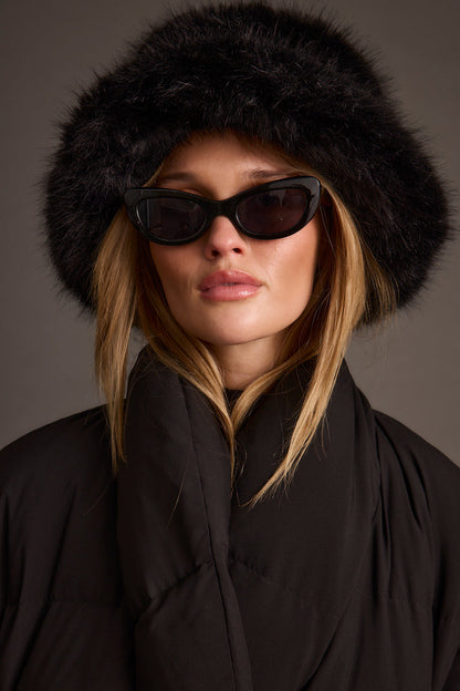 Styling option for the Bucket Down Black Faux Fur Hat shown with a complementary outfit.