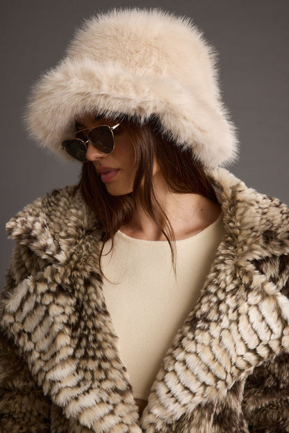 Bucket Down Cream Faux Fur Hat styled in a complete look from an alternate angle.