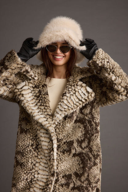 Detail shot of the Bucket Down Cream Faux Fur Hat highlighting the faux fur elements.