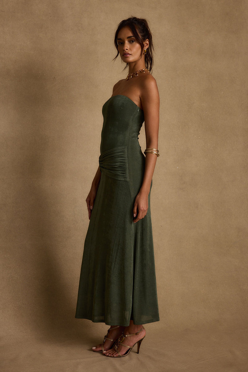 Cala Sol Emerald Maxi Dress paired with complementary accessories for a polished look.