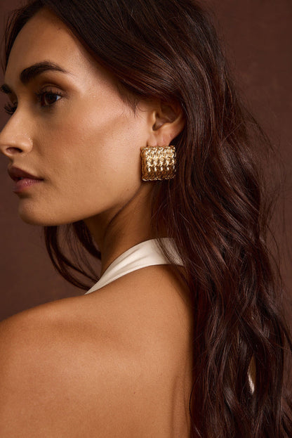Detail shot of the Calaia Gold Earrings highlighting the design elements.