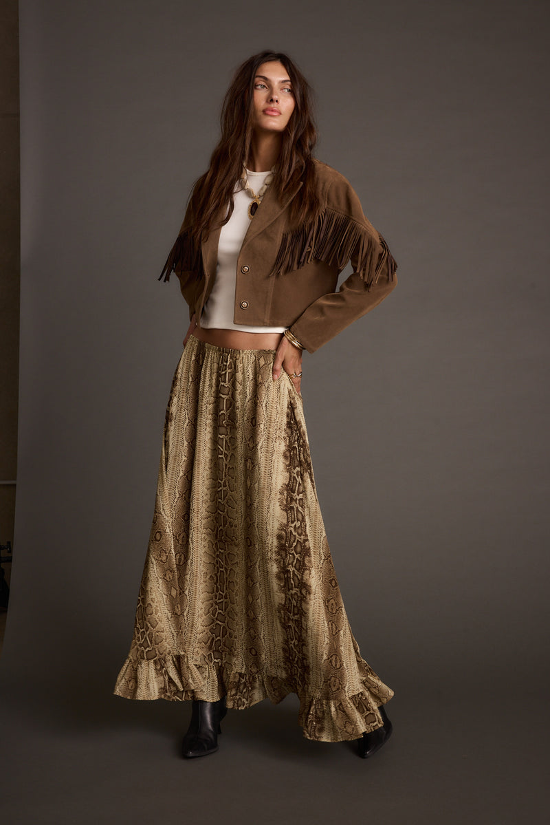 Full-length view of the maxi skirt showing the drape and movement.