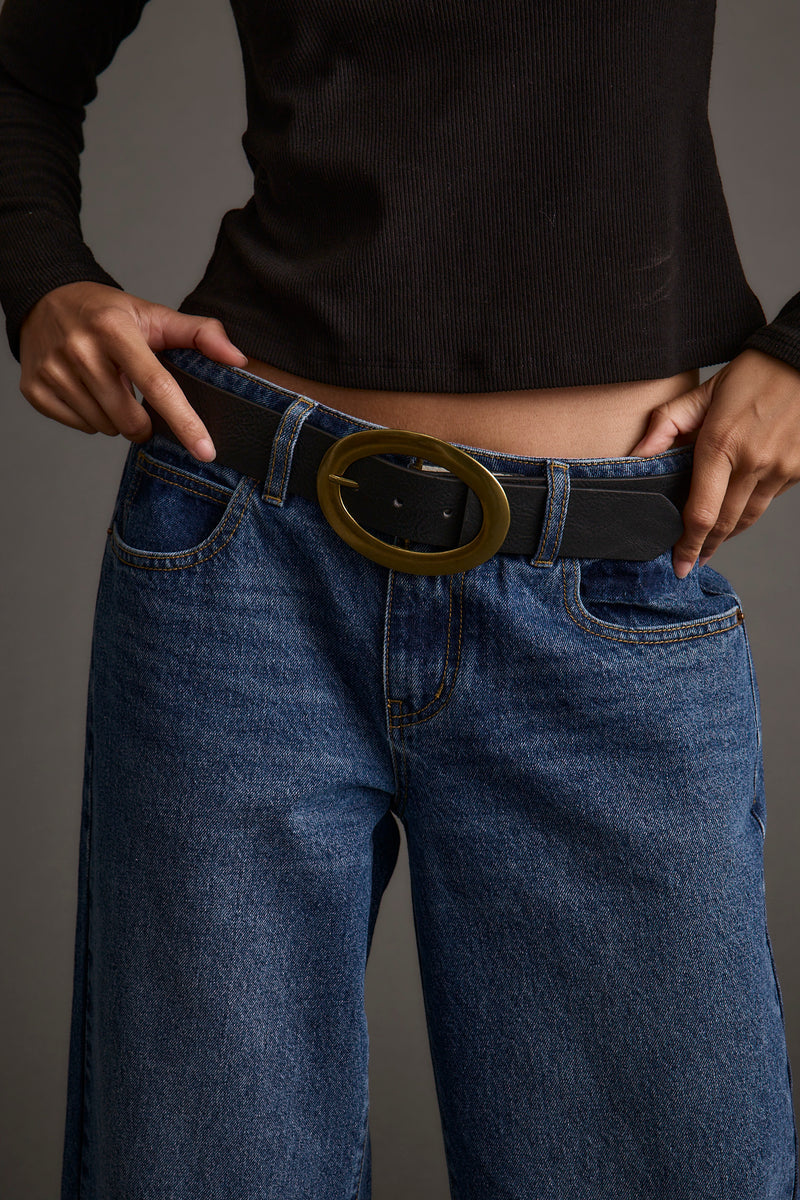 Close-up of the Candor Black and Oval Belt showcasing the fabric texture and design details.