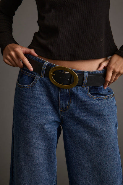 Close-up of the Candor Black and Oval Belt showcasing the fabric texture and design details.