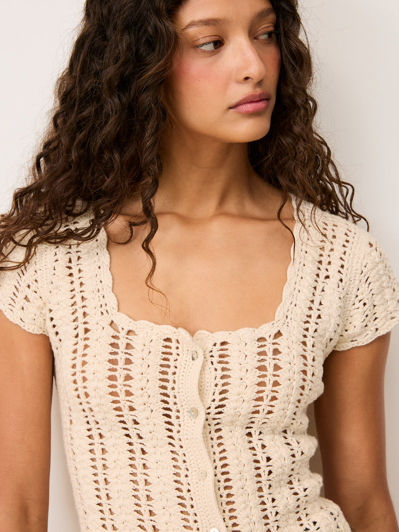 Zoomed in front view of Ademir ecru cotton cardigan worn by a model