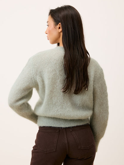 Maina cardigan in mint color worn, back view