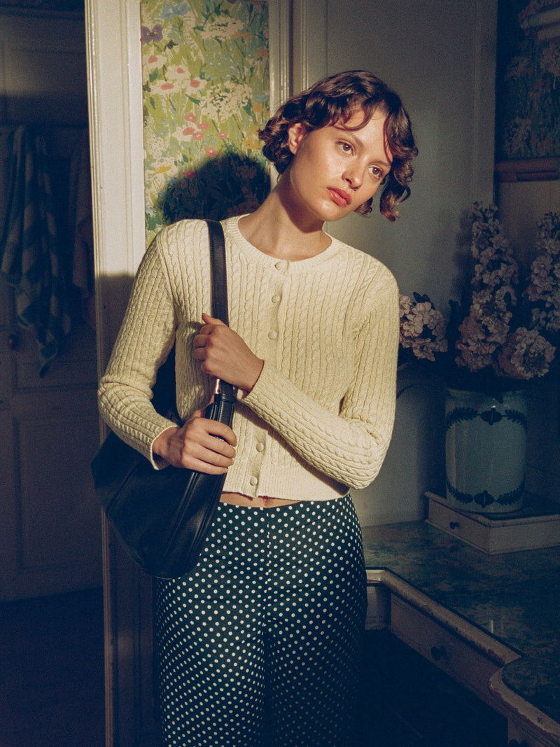 NACIM vanilla cable-knit cropped cardigan, flat packshot by Rouje