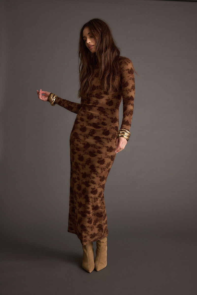 Close-up of the Casanova Brown Floral Maxi Dress showcasing the fabric texture and design details.