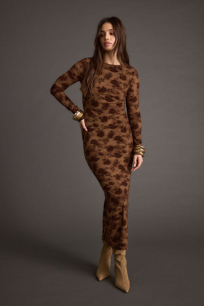 Lifestyle shot of the brown maxi dress styled for day-to-night versatility.