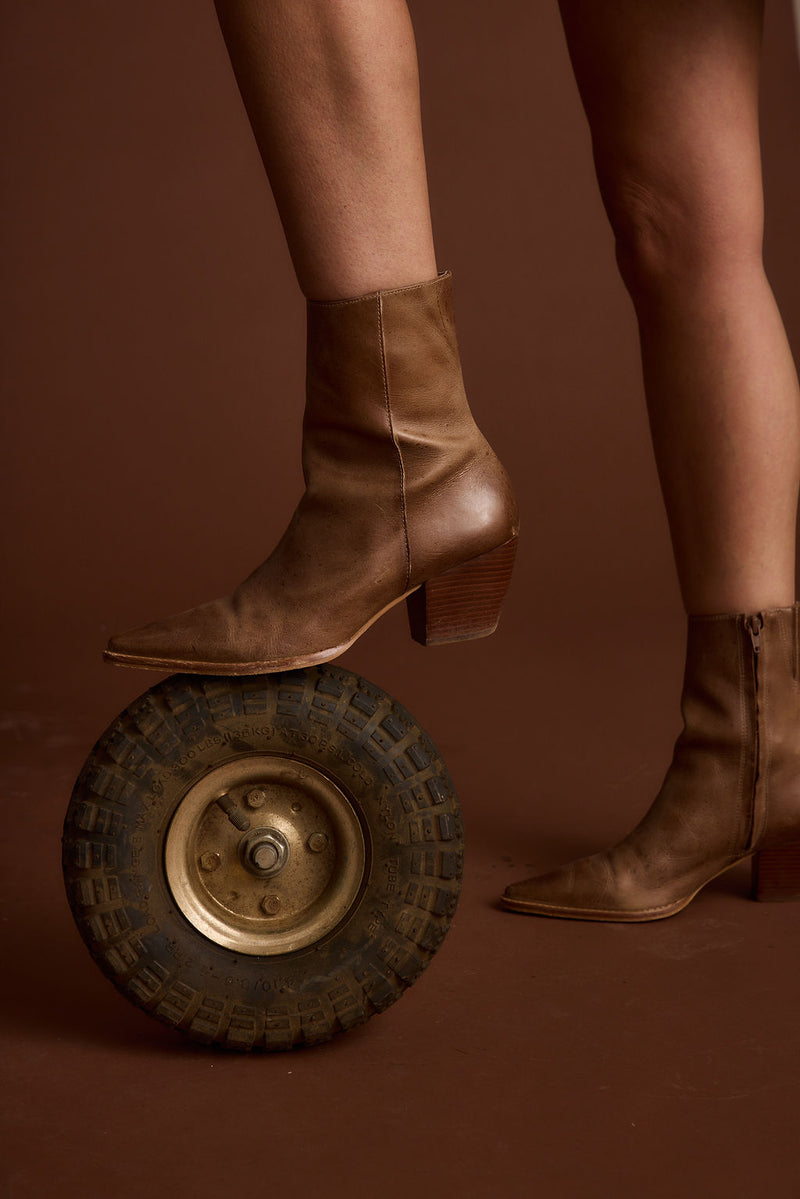 Close-up of the Caty Vintage Tan Boot showcasing the fabric texture and design details.