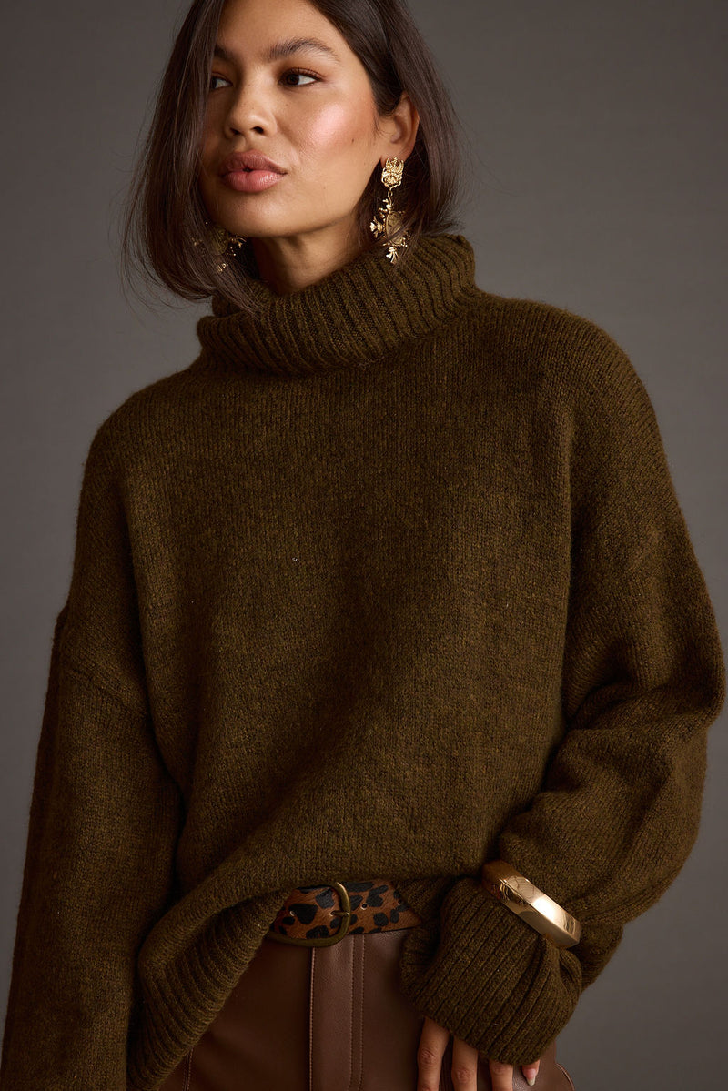 Close-up of the Cedar Oversized Sweater Turtleneck showcasing the fabric texture and design details.