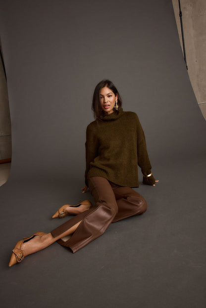 Lifestyle shot of the sweater styled for day-to-night versatility.