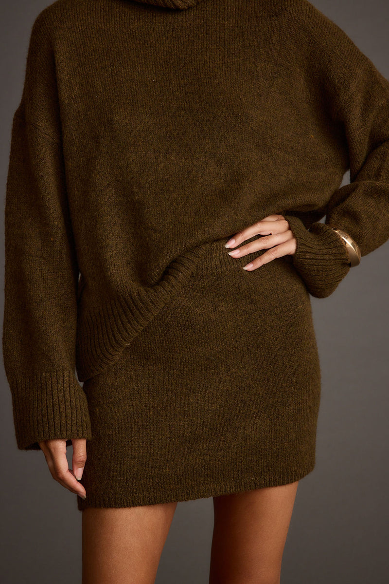 Back view of the sweater showing the silhouette and fit.