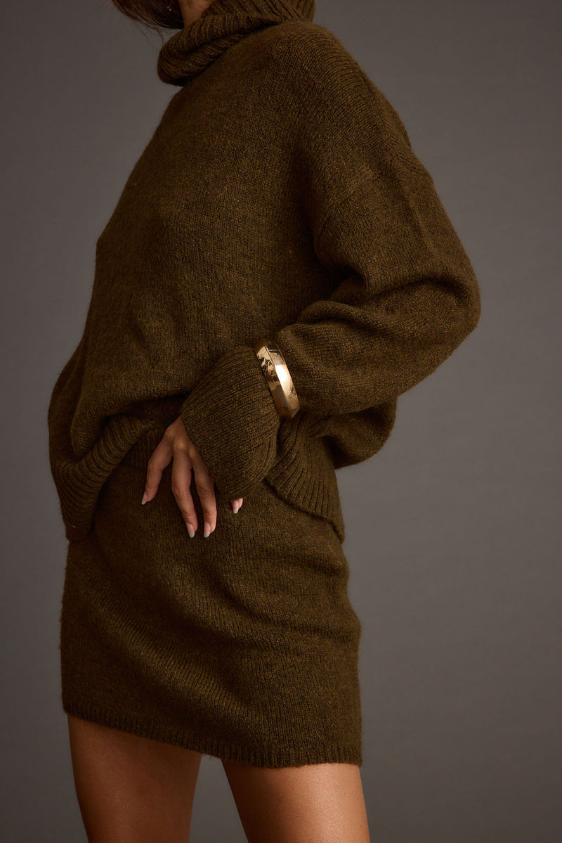 Cedar Sweater Mini Skirt paired with complementary accessories for a polished look.